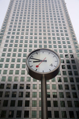 Fototapeta na wymiar London - clock and facade of Canary Wharf Tower