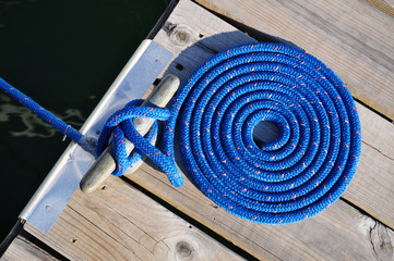 Coiled Blue Rope and Cleat