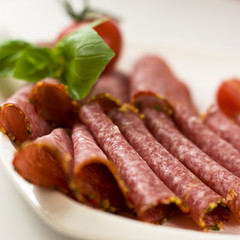 Salami with basil and tomatoes