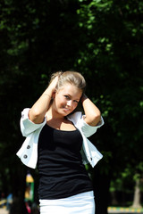 happy young girl on a background of the nature