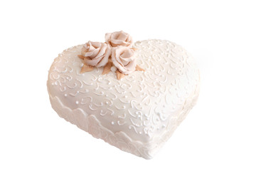 Fototapeta na wymiar Wedding cake in shape of heart decorated with marzipan roses