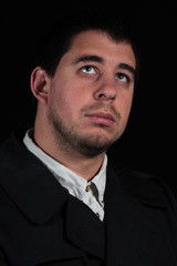 Male in thought, portrait isolated on black background