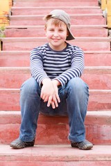 boy sitting on stairs