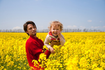 Fototapeta premium father with daughter on the rape field