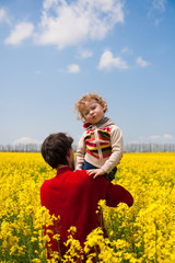 father with daughter on the rape field