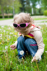 small girl with sunglasses in nature