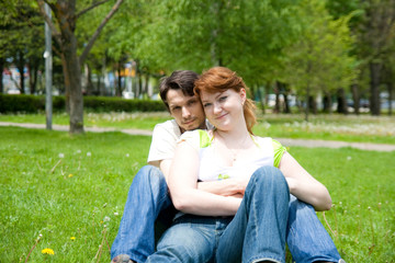 Naklejka premium man and woman on the green grass