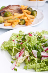 salad with pork chops with fries