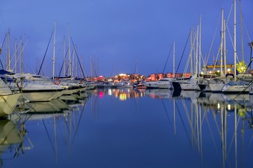 Fototapeta na wymiar Beautiful night blue marina in Mediterranean sea