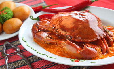 A whole spicy crab delicacy served with fried mantou - 14527946