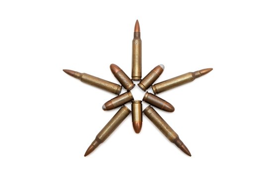 Five-pointed star of M16 and Parabellum cartridges isolated