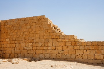 Broken wall of ancient temple ruin