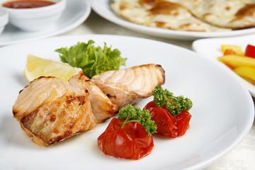 Fish is fried decoration tomato lemon greenery