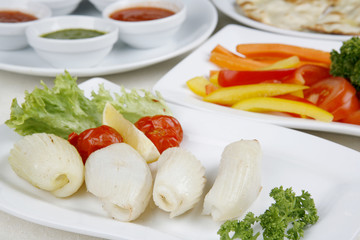 Calamary Squid to prepare a tomato pepper decoration greener
