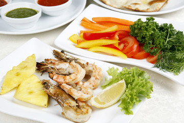 Fried shrimps decoration pineapple and greenery