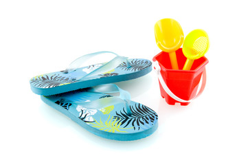 Blue flip flops with sandpit toys