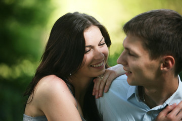 Fototapeta premium Man and woman sitting on the grass.