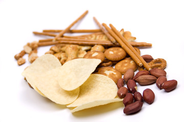 Potato chips and salty snacks isolated on white