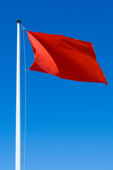 Red Warning Flag at the Beach