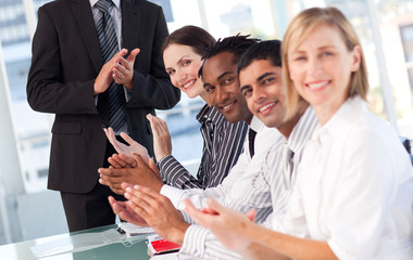 Business team clapping in a meeting