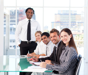 Business people looking at the camera in a meeting