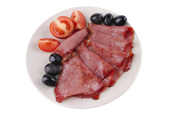 sliced served sausage with raw tomato