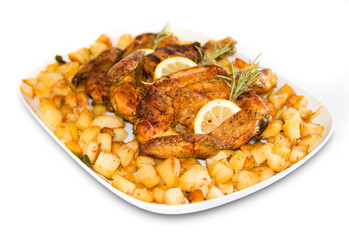 Roasted chicken with baby roast potatoes rosemary and lemon