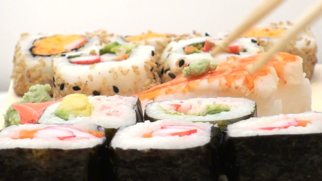 Eating a sushi roll close-up - HD