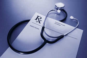 RX prescription form and stethoscope on stainless steel desk - obrazy, fototapety, plakaty