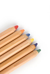 coloured big pencils with shadow on white background