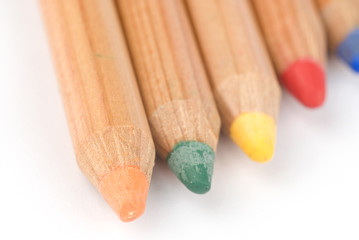 Colored wooden pencils. Soft focus.