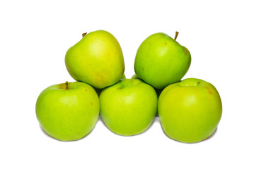 Stack of green apples isolated on white.