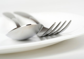 Photo of fork and spoon on plate
