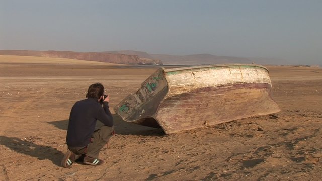 Fotograf mit Fischerboot