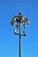 Ancient lamp on sidewalk