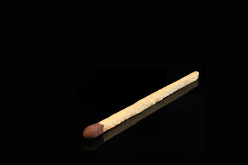 One match stick on black