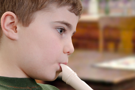 Child Playing Recorder