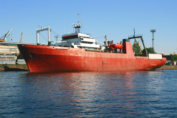 Fototapeta premium Red industrial ship in the harbor