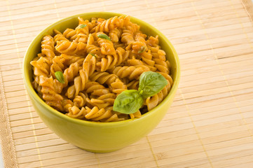 Fresh pasta with tomato sauce and basil.