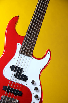 Red Electric Guitar Isolated on Yellow