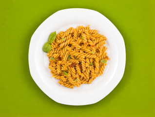 Italian pasta with tomato sauce and basil.