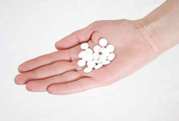 Hand Holding Aspirin