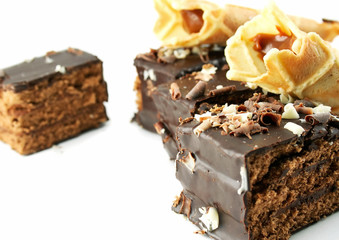 Pieces of a cake and pastries isolated