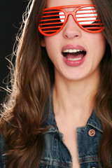 singing girl in red sunglasses