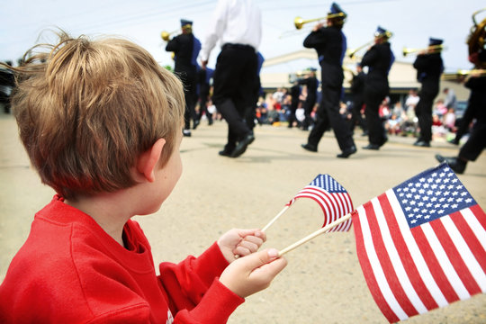 Young boy watching the memorial day parade