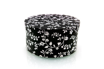 Black box with white flowers on white background
