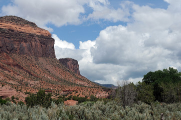 orange butte and clouds