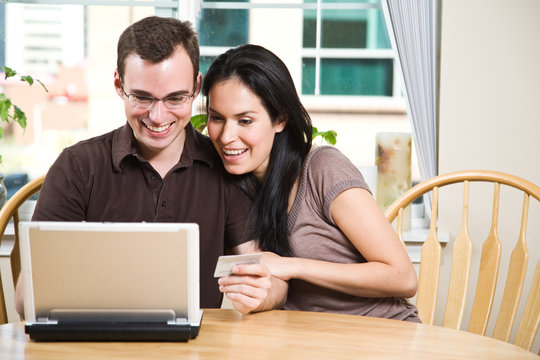 Happy couple shopping online