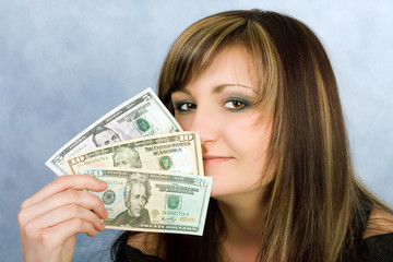 Pretty young woman with money