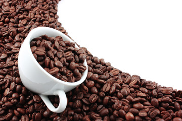 White cup filled with coffee beans
